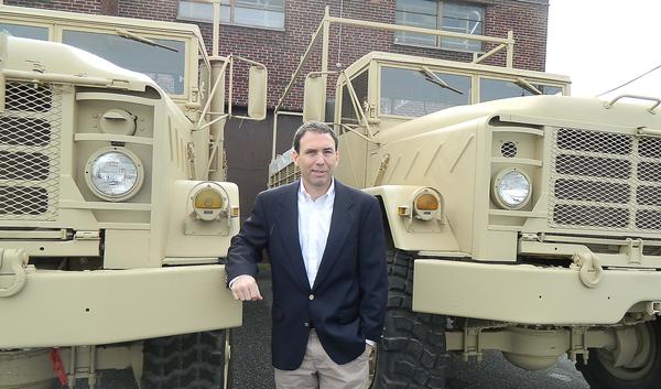 David Newman of Eastern Surplus with one of the military vehicles he sells