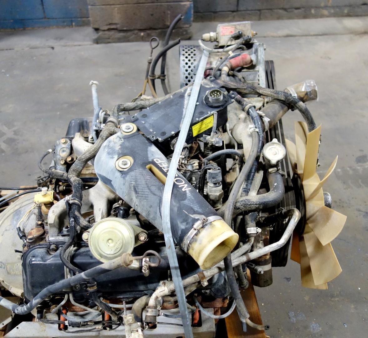 HM-698 | 6.2 Liter GM Diesel Engine with 3 Speed Automatic Transmission and Transfer Case USED (8).JPG